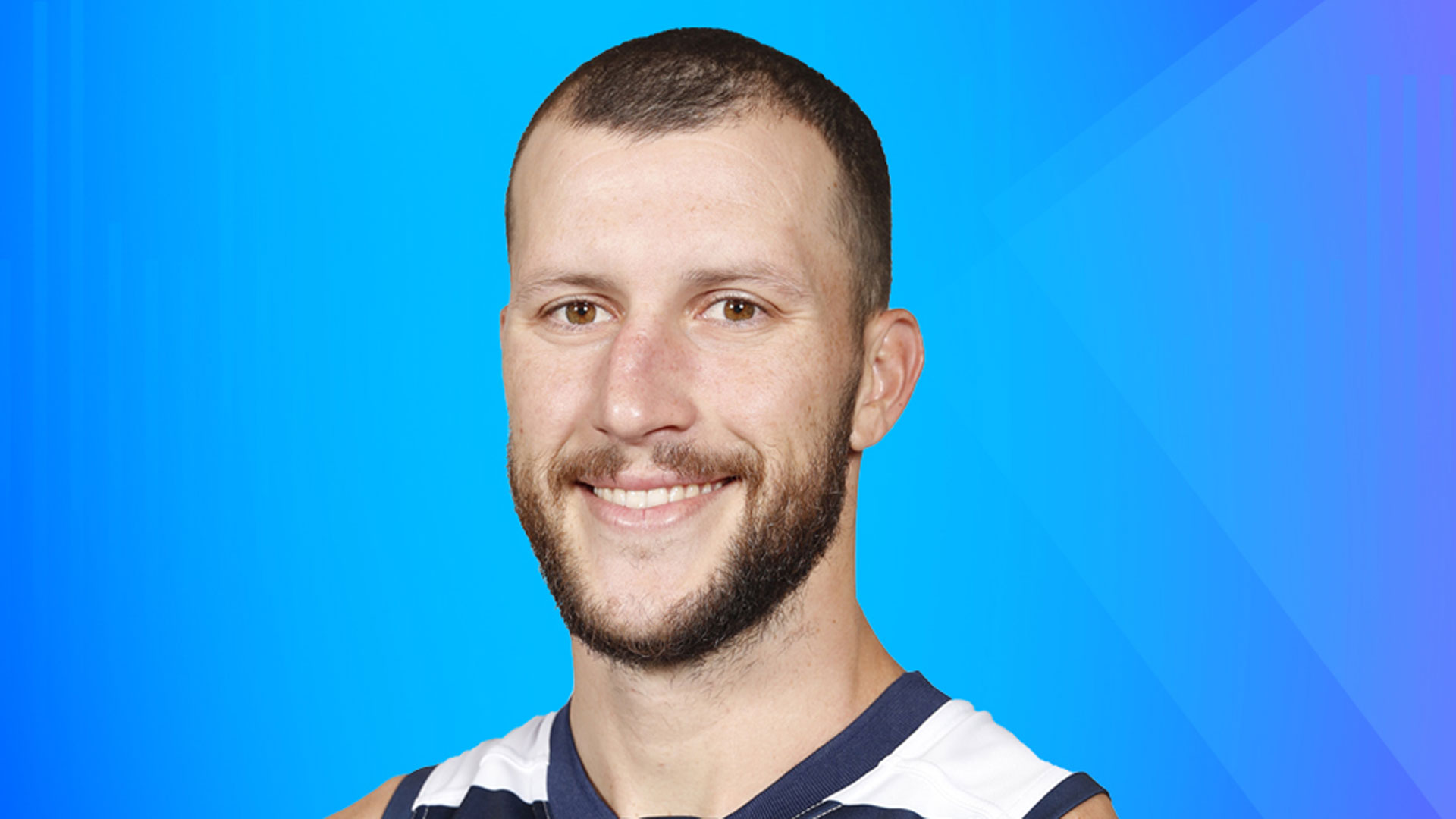 Young man with a beard and moustache in a football jersey